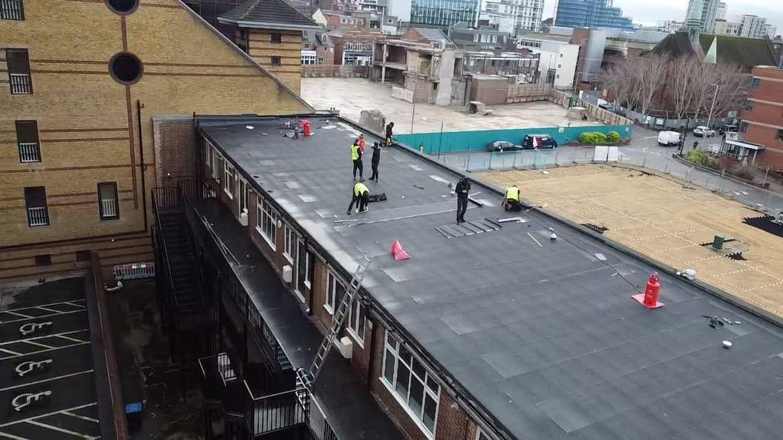 Aerial view of a commercial roof under refurbishment