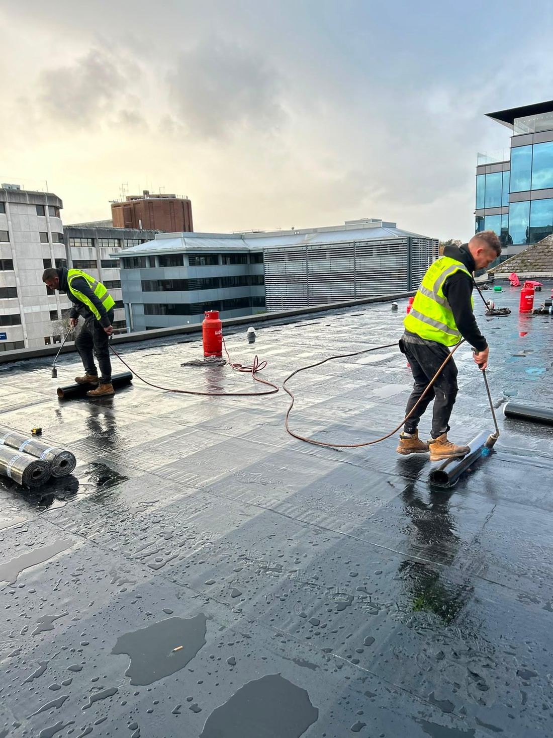 Tectum Roofing team at work on a commercial flat roof