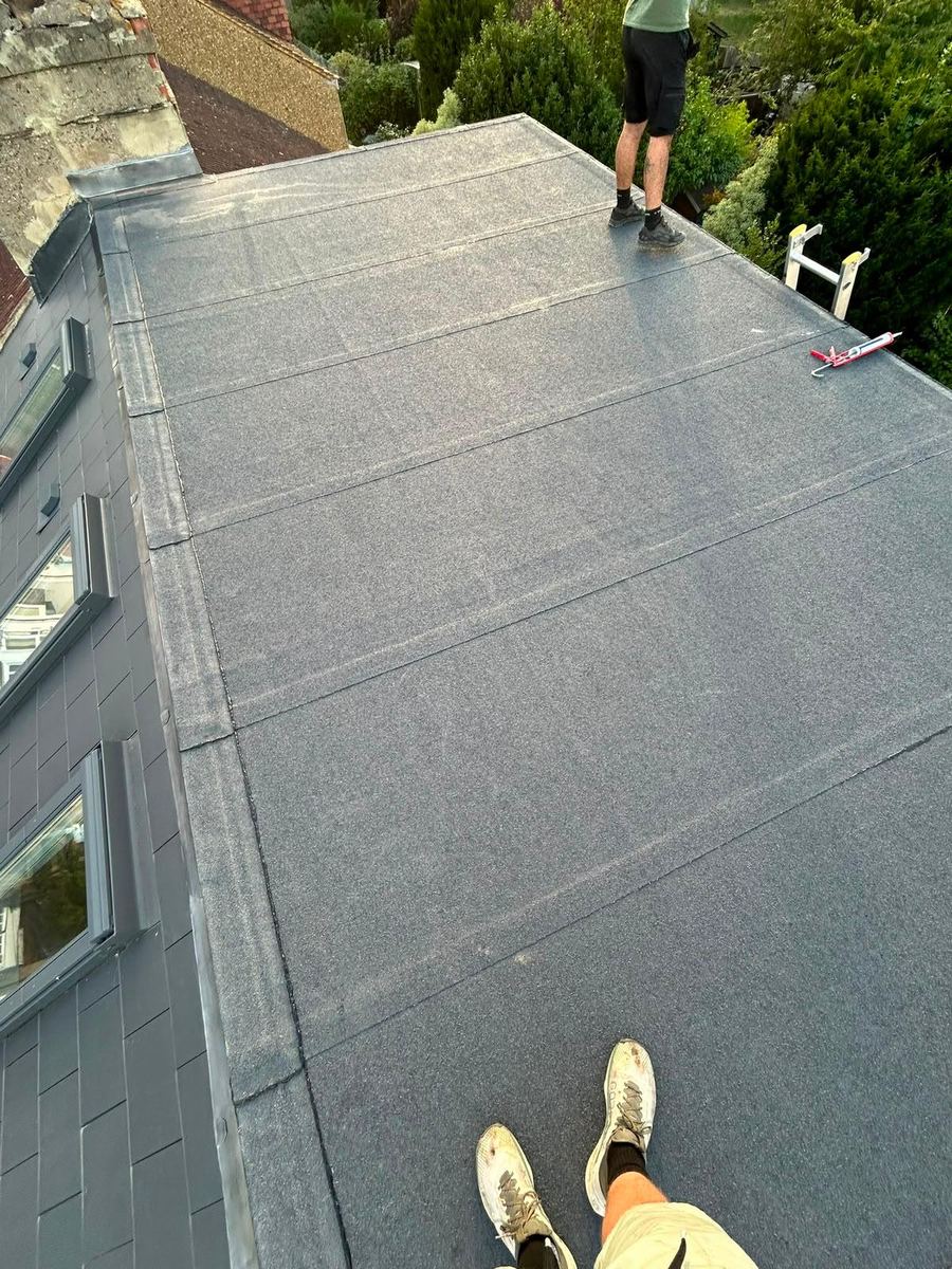A finished flat roof seen from the edge