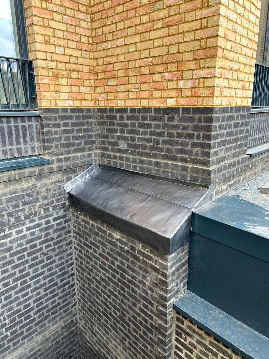 Leadwork dressed around a brick pier