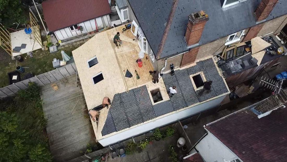 Aerial view of roofs being surveyed