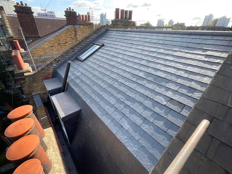 Slate roof with chimney stacks
